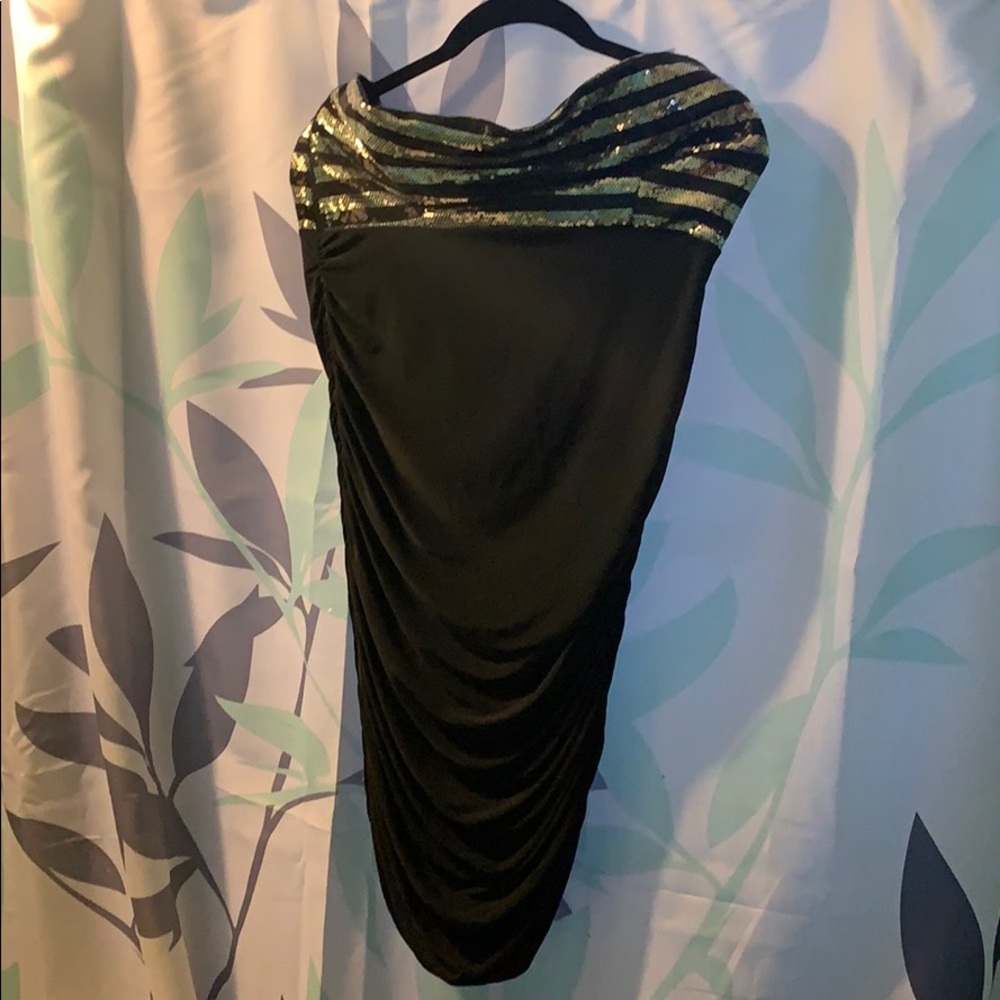 Cute little black strapless dress with sequins.